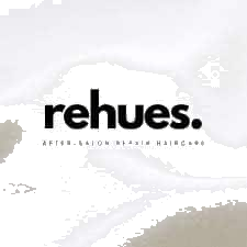 Rehues logo on a soft, textured background for haircare branding.